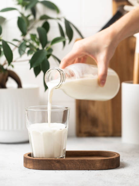 istock Milk is poured from a bottle into a glass 1770217231