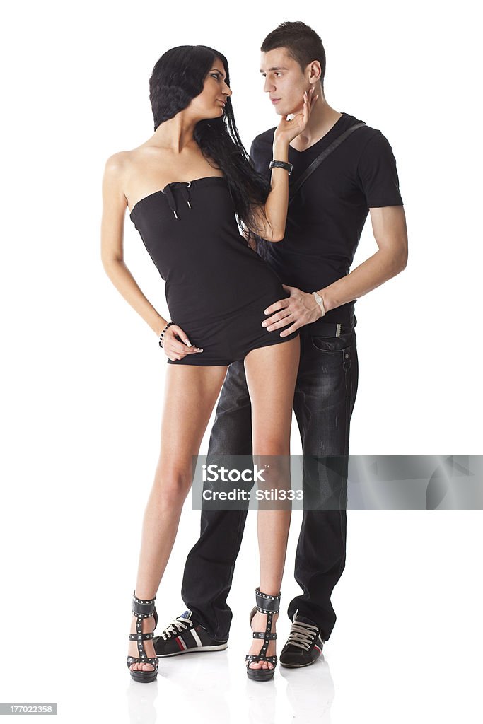 Young Couple In Love - Man Holding Woman "Young couple dresed in black, isolated on white background" Adult Stock Photo