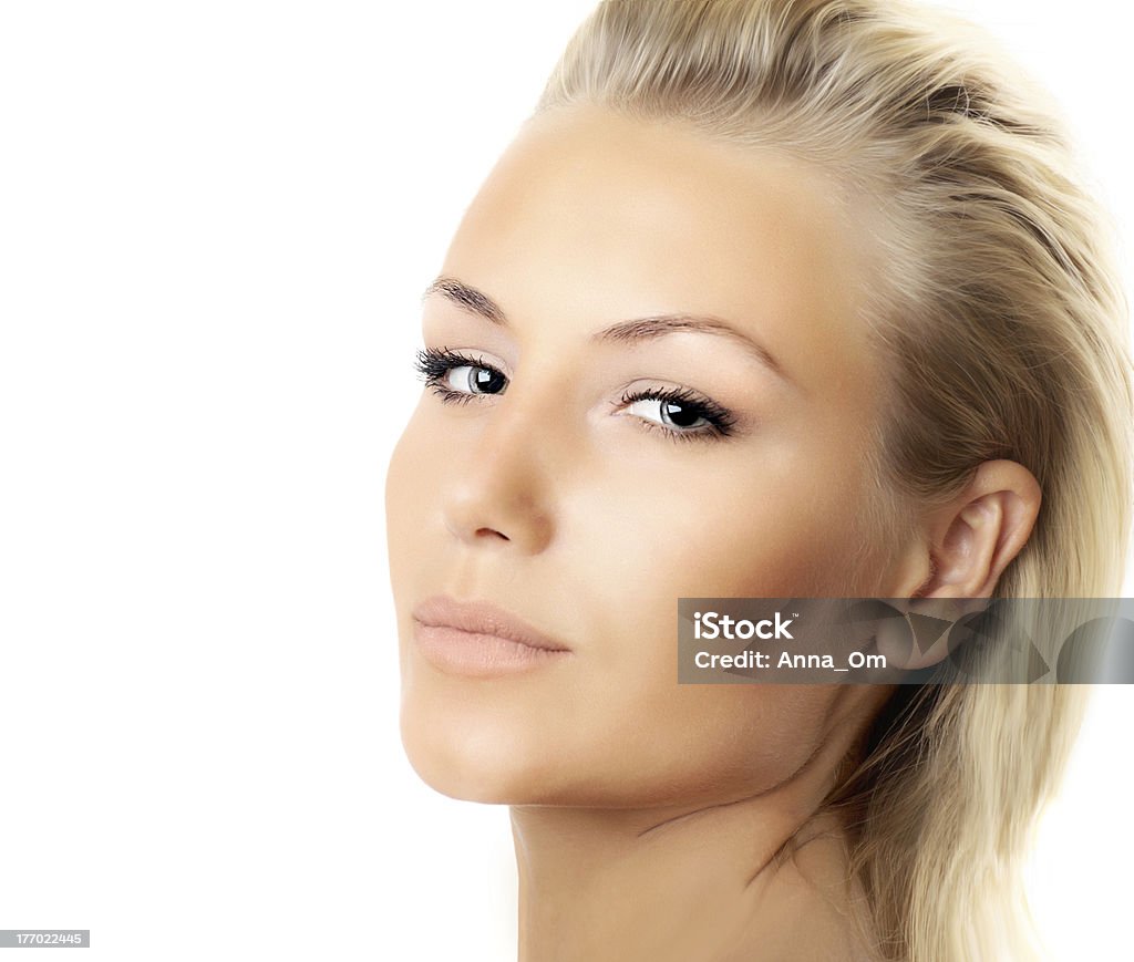 Closeup of beautiful female face isolated Closeup of beautiful female face isolated over white background, sexy blond woman with perfect soft skin, female beauty care, facial spa Adult Stock Photo