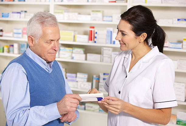 istock American pharmacist serving senior man in pharmacy 177023076