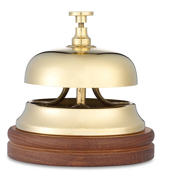istock brass hotel bell low angle on white with clipping path 177023518