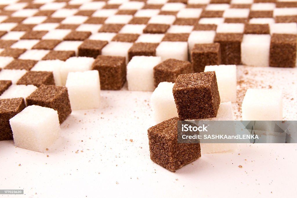 White and brown sugar. Focused three blocks of sugar with much on the background. Beige Stock Photo