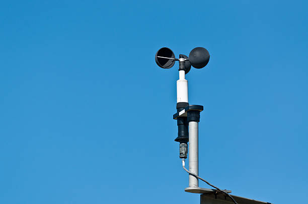 A cup-type anemometer measures the wind speed at a meteorological station.
