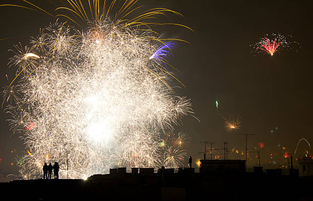 people watching the amazing firework from the roofs