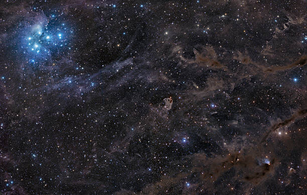 Pleiades in galactic dust stock photo