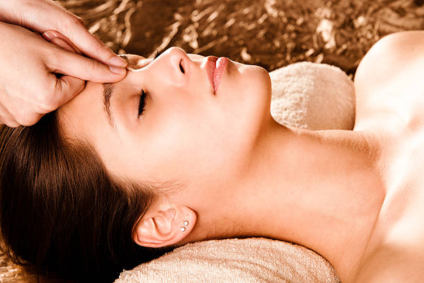 Women receiving a facial massage acupressure face massage shiatsu photos stock pictures, royalty-free photos & images