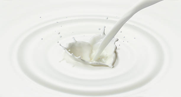 istock pouring milk created splash in heart shape 177025729