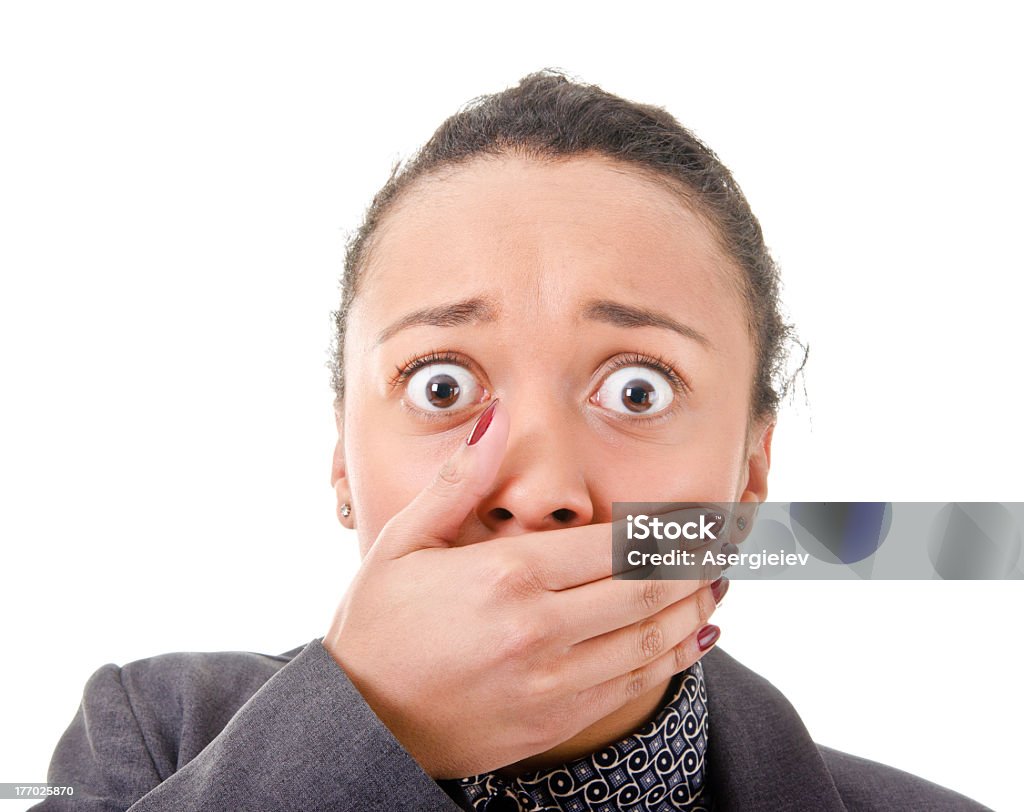Unheard of! Portrait of a girl covering the palm of her mouth Adult Stock Photo
