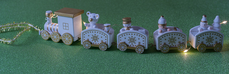 white decorative wooden train for christmas in panoramic format