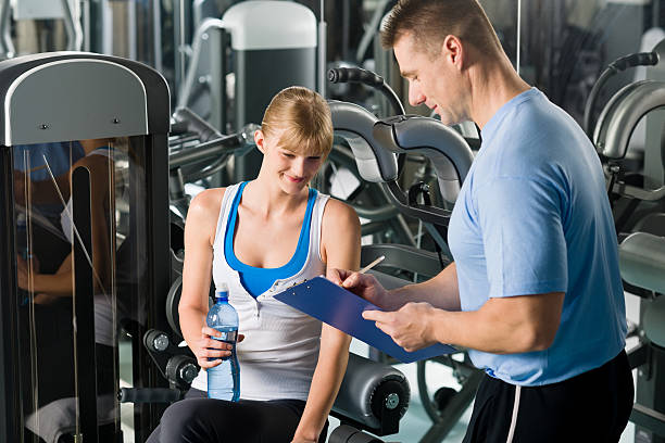 istock Completing personal fitness plan with trainer 177025929