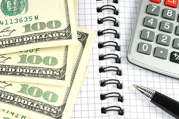 istock Money, calculator, and pen 177026369