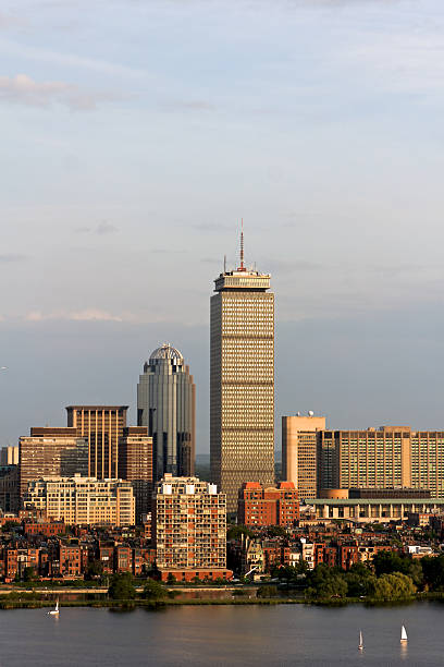 Boston Back Bay with the Prudential Tower "View of the Boston, MA Skyline of Back Bay, including the landmark Prudential Tower. Seen from near Kendall/MIT across the Charles river in Cambridge, MA." boston prudential building stock pictures, royalty-free photos & images