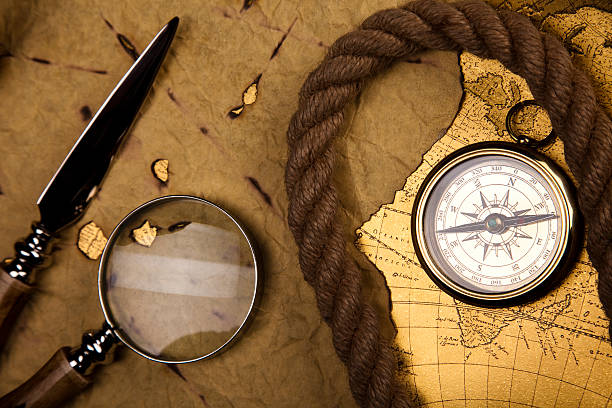 istock Compass on the old paper background 177027513