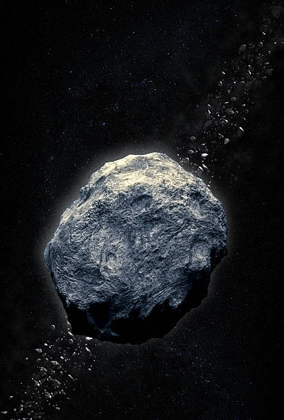 a gray asteroid heading for earth against a dark background - asteroit stok fotoğraflar ve resimler