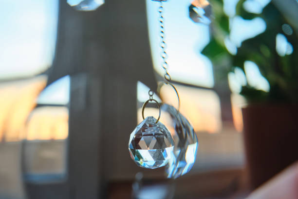 Abstract background with suncatcher crystals on home interior background.