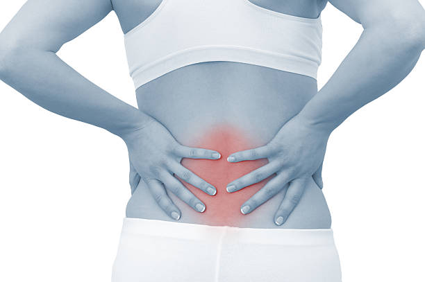 急性痛の女性の背中 - backache human spine lumbosacral region blue ストックフォトと画像