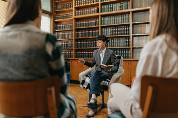 istock Asian psychotherapist discussing issues with group of female students 1770289390
