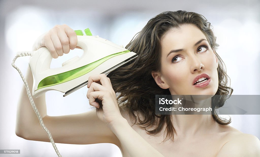 iron she stroked her hair Heat - Temperature Stock Photo