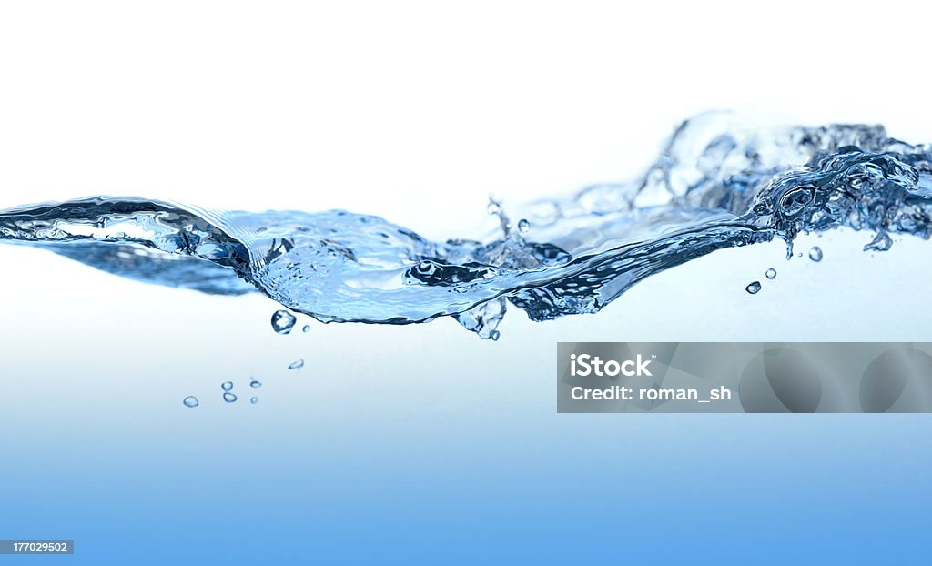 Water Curved Wave. Close-up picture of abstract water wave with bubbles. Abstract Stock Photo