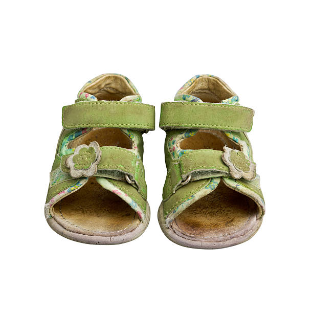 istock Used green child sandals isolated on white 177029917