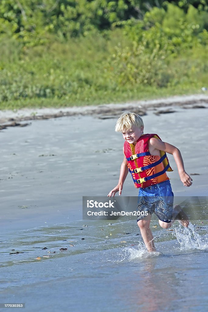 Corriendo en la playa - Foto de stock de Agua libre de derechos