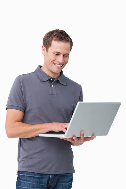 istock Smiling young man working on laptop 177030640