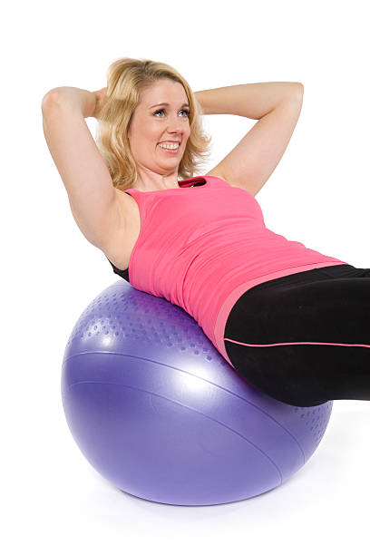 istock Caucasian woman exercises on a ball 177030807