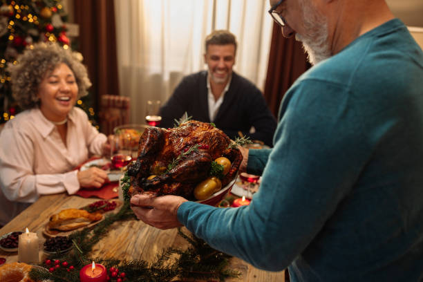 istock Grandpa bringing roasted meat to the dining table 1770309303