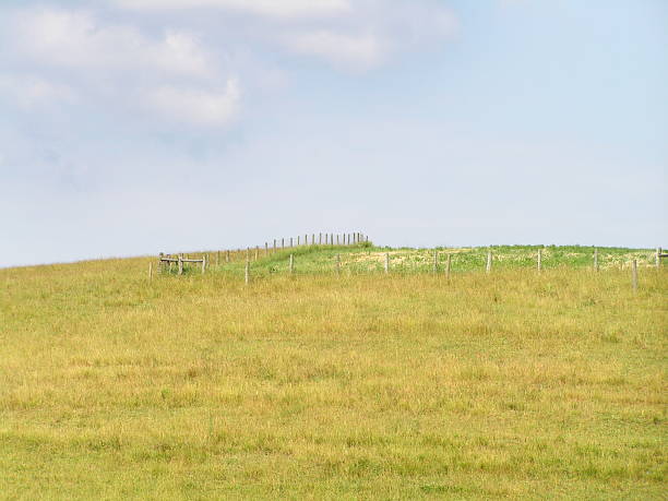 istock hill and fence 177030957