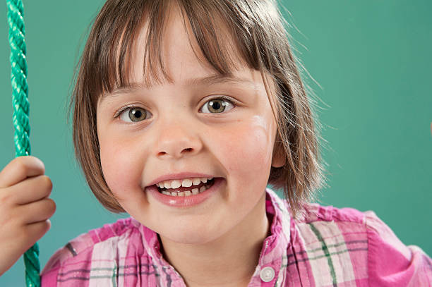 istock little girl with big smile 177031042