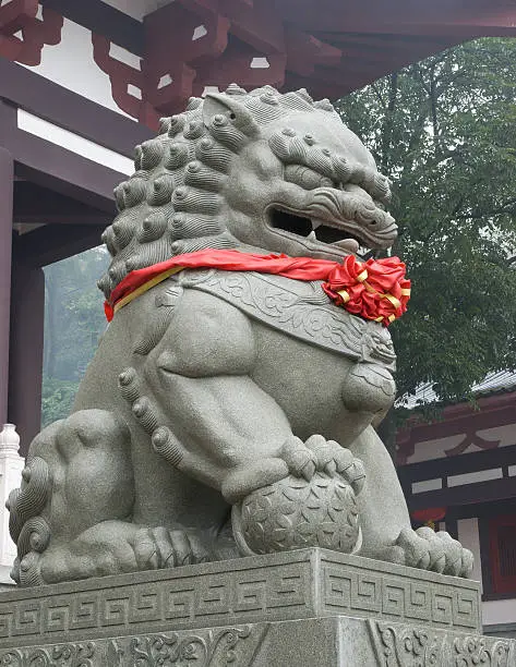 fengshui lion with red ribbon