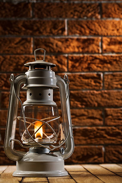 istock kerosene lamp on brick background 177031534