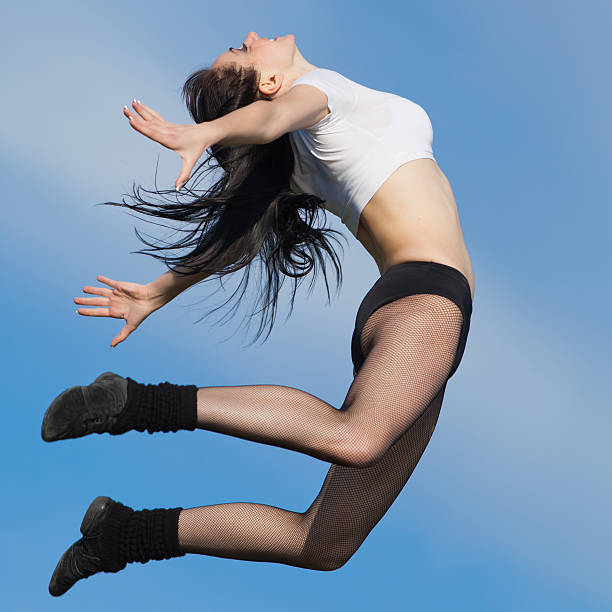 istock Brunette jumps on background of sky 177031742