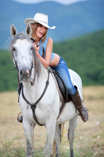 Cute cowgirl riding