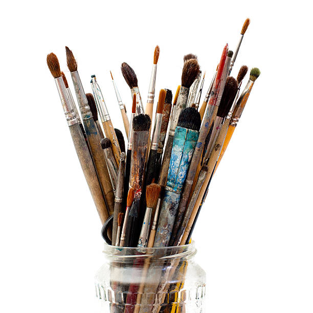 istock Assorted dirty painting brushes in glass flask 177032938