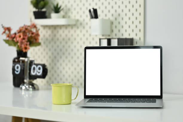 istock Home office desk with laptop, coffee cup and book. Empty display for your advertising text message 1770332930