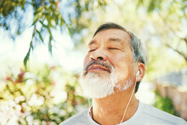 breathe, fitness and senior man in nature on a break after a running exercise for race training. health, sports and elderly male athlete runner after a cardio workout in outdoor park or garden. - senior adult human face male action imagens e fotografias de stock