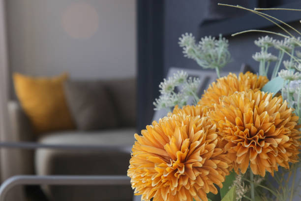 istock Nice orange flowers in vase on the balcony table, home decor concept 1770337784