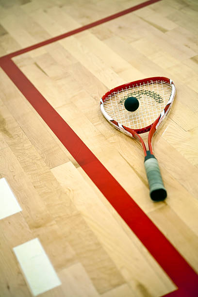 istock A squash racket on a court with a ball 177033911