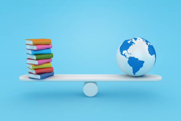 istock Stack of Books on Seesaw with Globe World Map 1770341694