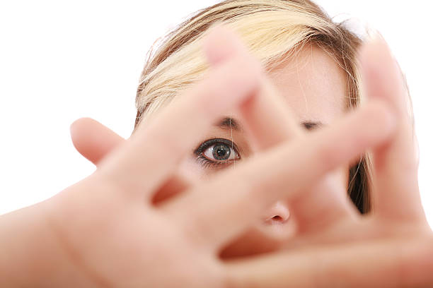 istock female hide face behind her hand, keep away gesture, 177034859