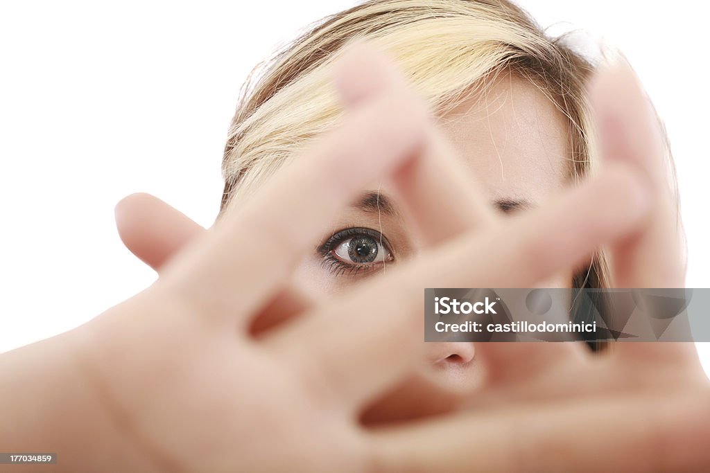 female hide face behind her hand, keep away gesture, "blonde female hide her face behind her hand, keep away gesture, isolated on white background" Abuse Stock Photo