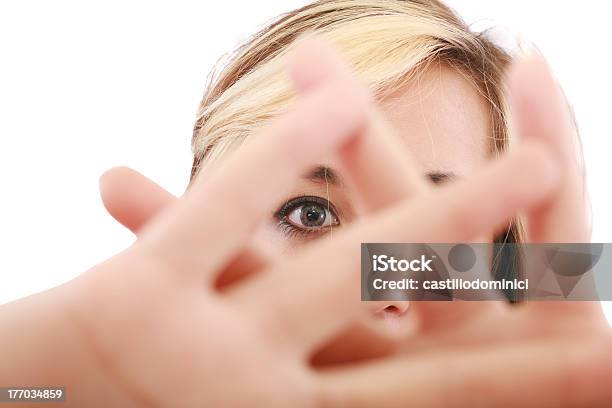 Female Hide Face Behind Her Hand Keep Away Gesture Stock Photo - Download Image Now