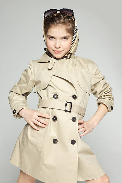 istock Girl posing in trench coat 177035457