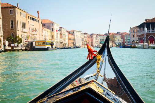 A view from gondola during the ride through the canals of Venice in Italy