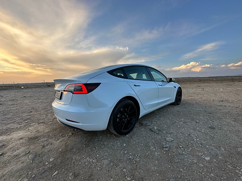 erevan, Armenia – October 24, 2023: A white Tesla model 3 parked outdoors at sunset