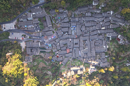Drone view of Chinese tradition village on top of mountains at Ningbo, Zhejiang Province, China, high angle view of beautiful village  in forest.