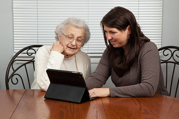 istock Woman Using Tablet Computer with her Grandmother 177036720