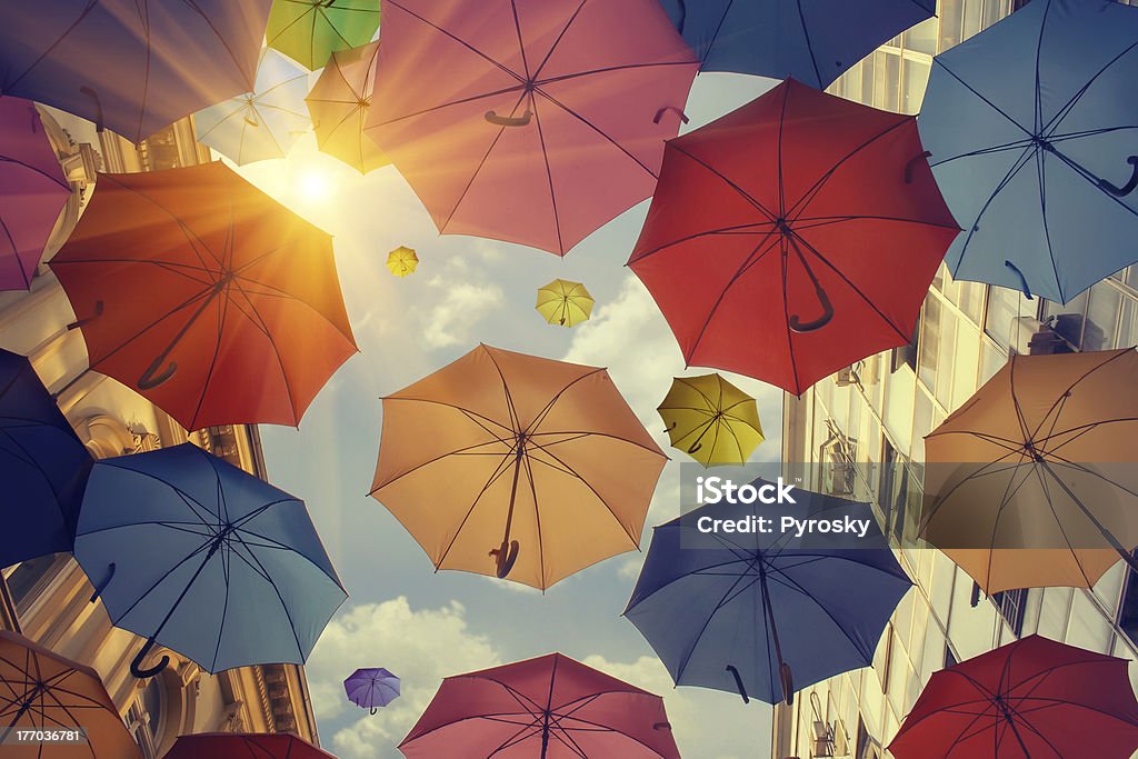 Umbrellas falling from the sky Photo of umbrellas falling from the sky. Umbrella Stock Photo