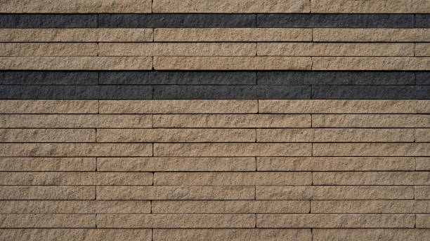 Dark black anthracite beige rustic stone wall texture pattern, privacy protection outdoor garden architecture background